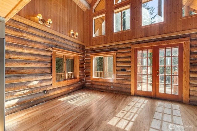 unfurnished sunroom featuring french doors and a wealth of natural light