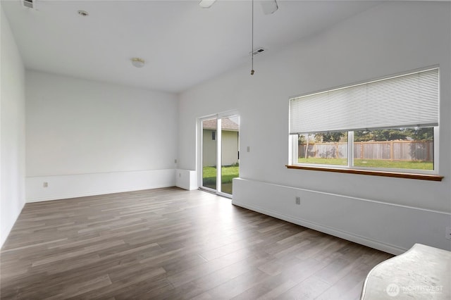 8703 232nd Street Ct E, Graham, WA 98338 - interior space with visible vents, wood finished floors, and baseboards
