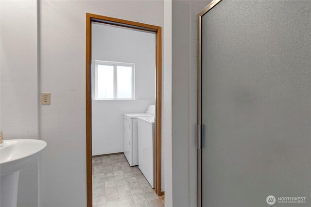 8703 232nd Street Ct E, Graham, WA 98338 - full bath featuring a shower with shower door, independent washer and dryer, and a sink