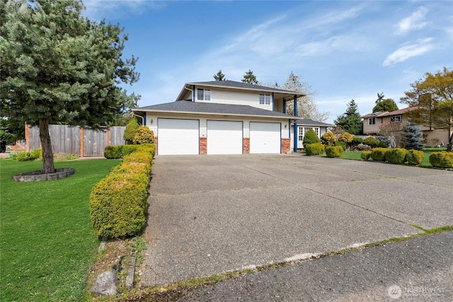 8703 232nd Street Ct E, Graham, WA 98338 - traditional-style home featuring brick siding, driveway, fence, and a front yard