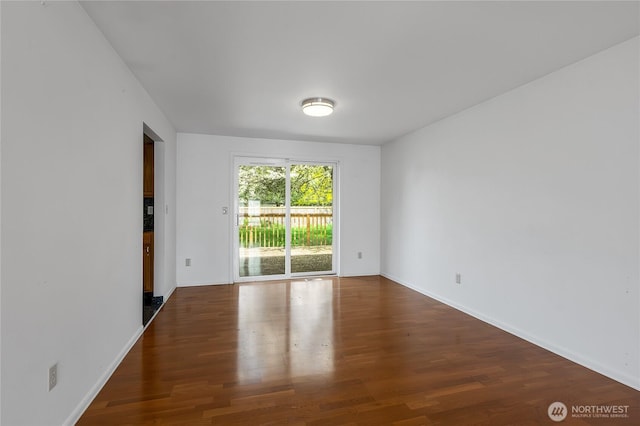 8703 232nd Street Ct E, Graham, WA 98338 - unfurnished room with wood finished floors and baseboards
