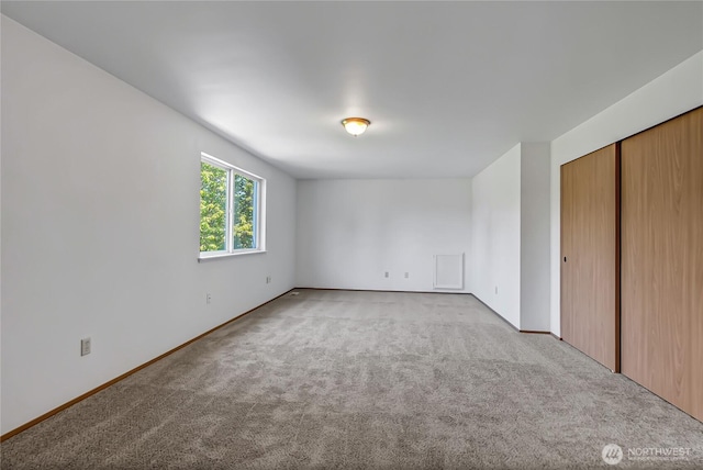 8703 232nd Street Ct E, Graham, WA 98338 - unfurnished bedroom with carpet flooring, baseboards, and a closet