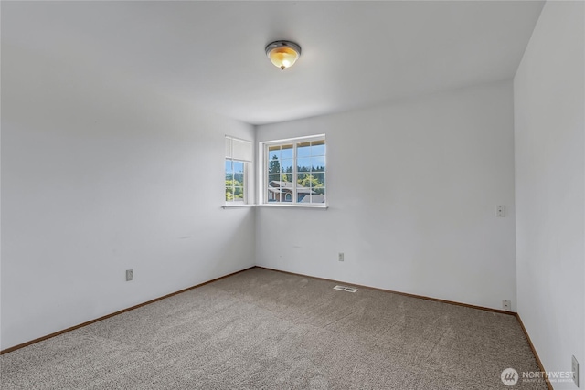 8703 232nd Street Ct E, Graham, WA 98338 - carpeted empty room featuring visible vents and baseboards