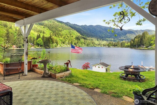 3058 Camp 2 Rd, Sedro Woolley, WA 98284 - view of patio featuring a fire pit, a view of trees, and a water and mountain view