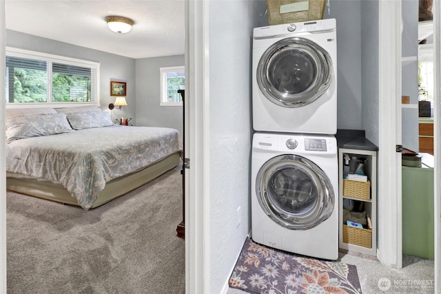 3058 Camp 2 Rd, Sedro Woolley, WA 98284 - washroom with stacked washer and clothes dryer and carpet flooring