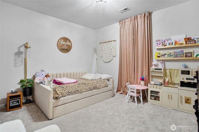 bedroom with visible vents and carpet floors