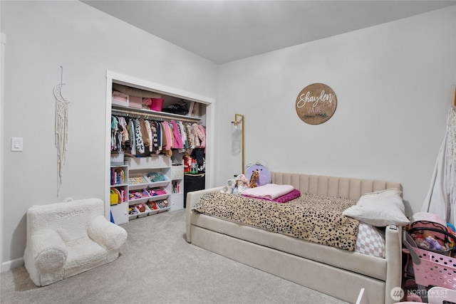 carpeted bedroom with a closet