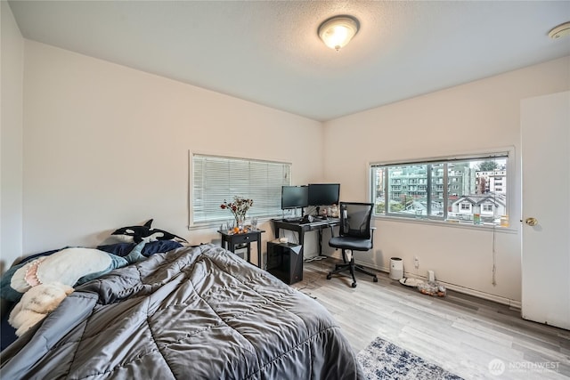 bedroom featuring wood finished floors