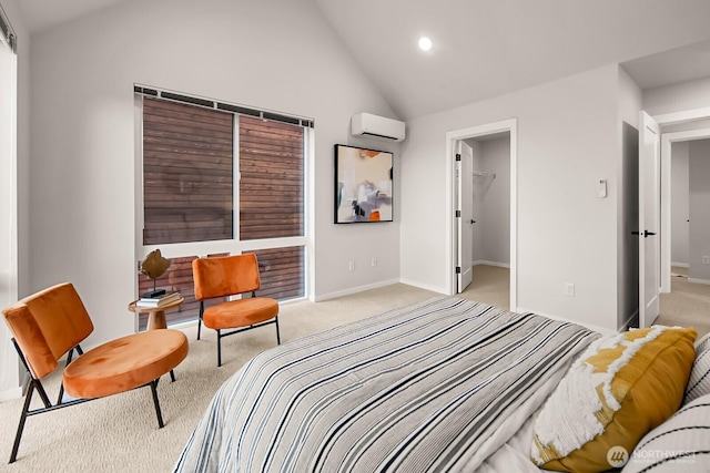bedroom with a wall unit AC, light colored carpet, a spacious closet, lofted ceiling, and baseboards