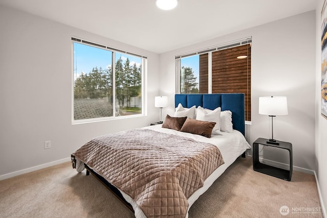 carpeted bedroom with baseboards