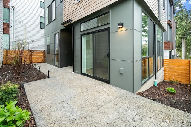 view of patio featuring fence