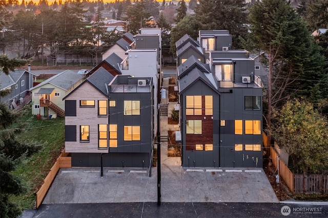 aerial view at dusk featuring a residential view