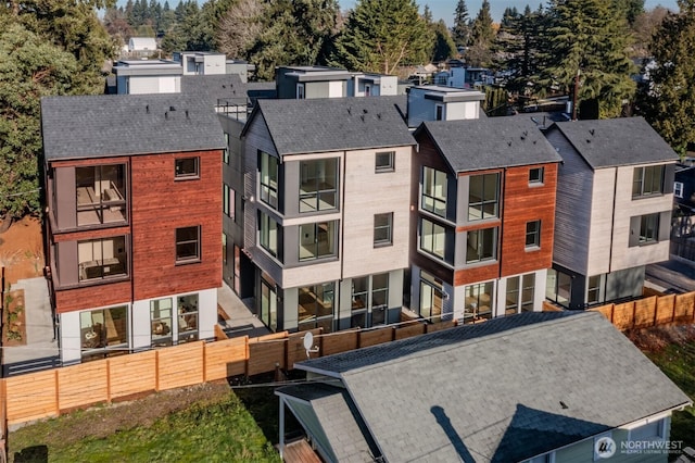 view of property featuring a residential view and fence