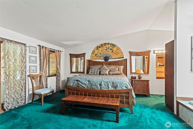 carpeted bedroom with lofted ceiling