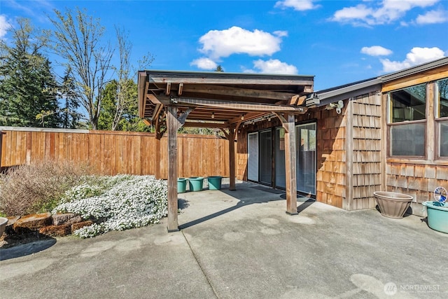 view of patio / terrace featuring fence