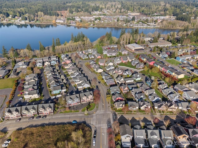 bird's eye view featuring a water view and a residential view