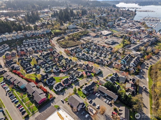 bird's eye view featuring a residential view and a water view