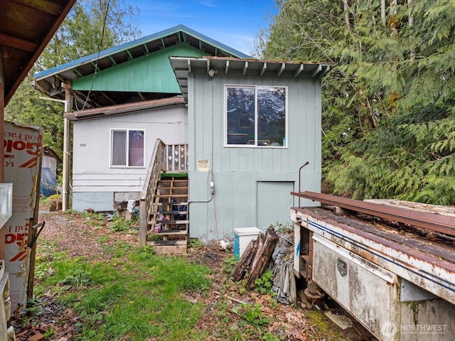 back of property with stairway