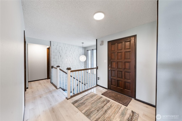 478 SW Judson Dr, Oak Harbor, WA 98277 - foyer with light wood-style floors and a textured ceiling