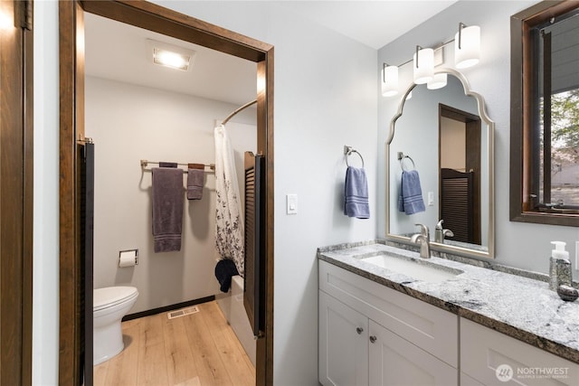 478 SW Judson Dr, Oak Harbor, WA 98277 - bathroom featuring toilet, wood finished floors, vanity, and visible vents