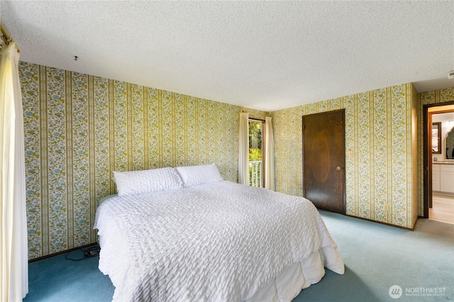 478 SW Judson Dr, Oak Harbor, WA 98277 - bedroom with carpet floors, a textured ceiling, and wallpapered walls