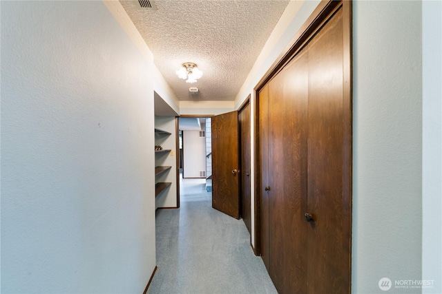 478 SW Judson Dr, Oak Harbor, WA 98277 - hallway featuring baseboards and a textured ceiling