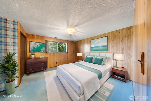 478 SW Judson Dr, Oak Harbor, WA 98277 - bedroom featuring wood walls and a textured ceiling