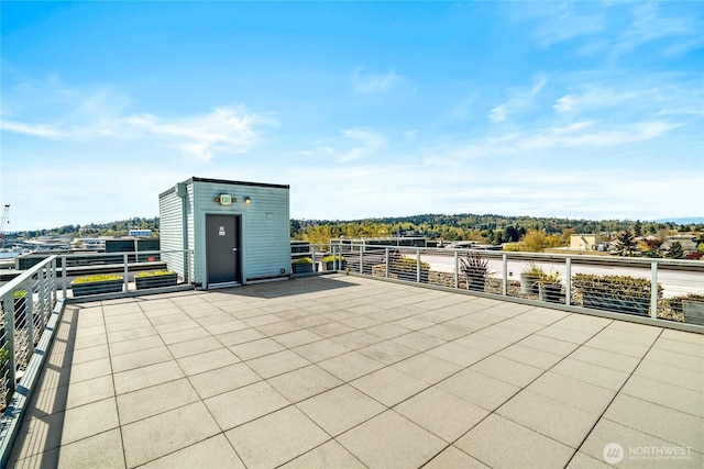 5615 24th Ave NW Unit 24, Seattle, WA 98107 - view of patio / terrace featuring an outbuilding