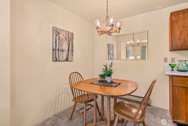 carpeted dining space with a baseboard radiator and an inviting chandelier