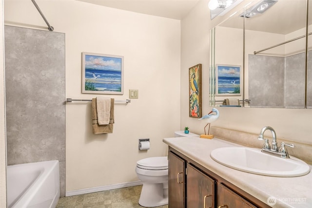 bathroom featuring vanity, baseboards, and toilet