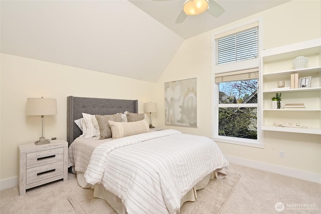 bedroom featuring carpet flooring, a ceiling fan, baseboards, and lofted ceiling