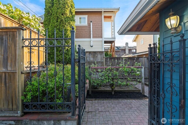 view of gate with fence