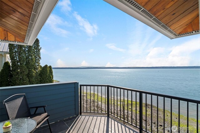 balcony featuring a water view