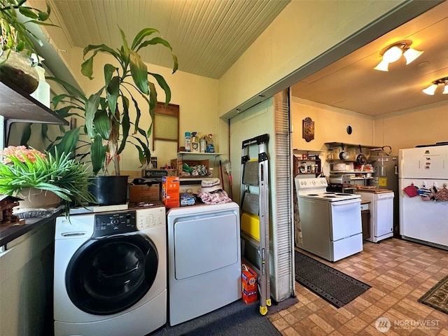 107 Martin Rd, Glenoma, WA 98336 - laundry area with washer and dryer, tile patterned floors, laundry area, and water heater