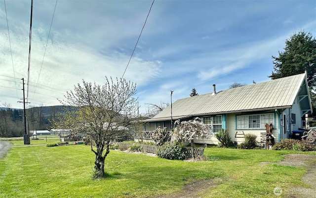 107 Martin Rd, Glenoma, WA 98336 - view of front of house with metal roof and a front yard
