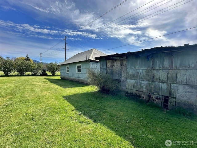 107 Martin Rd, Glenoma, WA 98336 - view of side of property with metal roof and a lawn