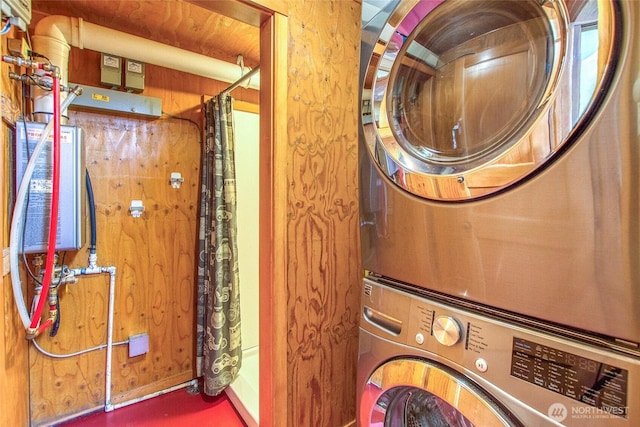 washroom featuring stacked washing maching and dryer