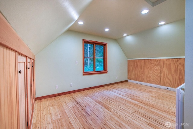 bonus room featuring lofted ceiling, baseboards, recessed lighting, and wood finished floors