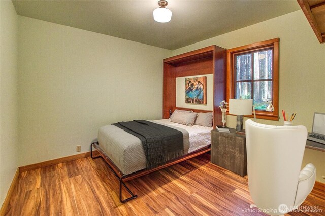 104 Barn Owl Trl, Orcas Island, WA 98245 - bedroom with wood finished floors and baseboards