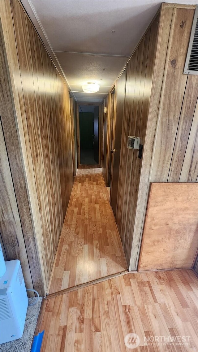 8458 Shintaffer Rd, Blaine, WA 98230 - hall with wood walls and light wood finished floors