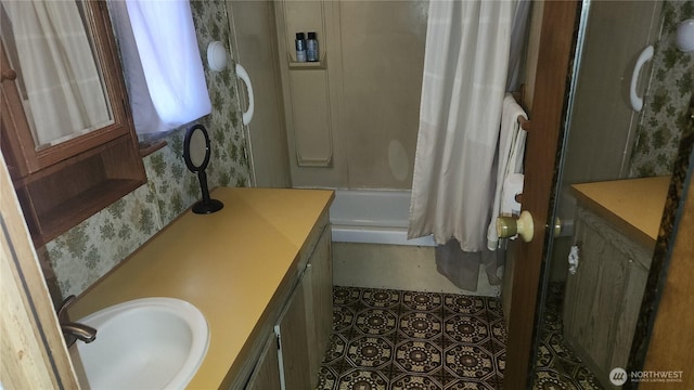 8458 Shintaffer Rd, Blaine, WA 98230 - bathroom with wallpapered walls, vanity, and shower / bathtub combination with curtain