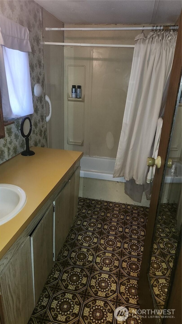 8458 Shintaffer Rd, Blaine, WA 98230 - bathroom with shower / bath combo, vanity, and wallpapered walls