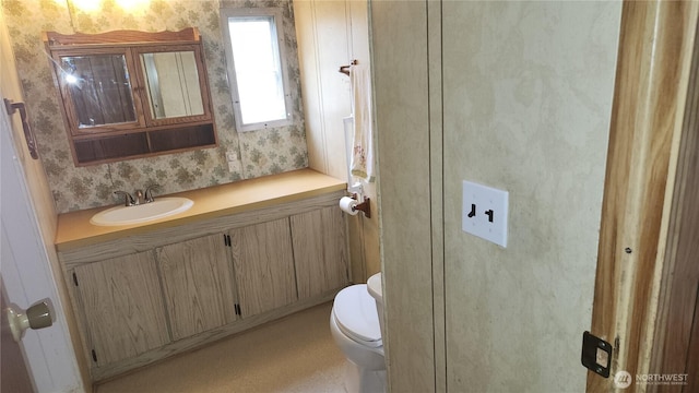 8458 Shintaffer Rd, Blaine, WA 98230 - half bathroom with toilet, wallpapered walls, and vanity