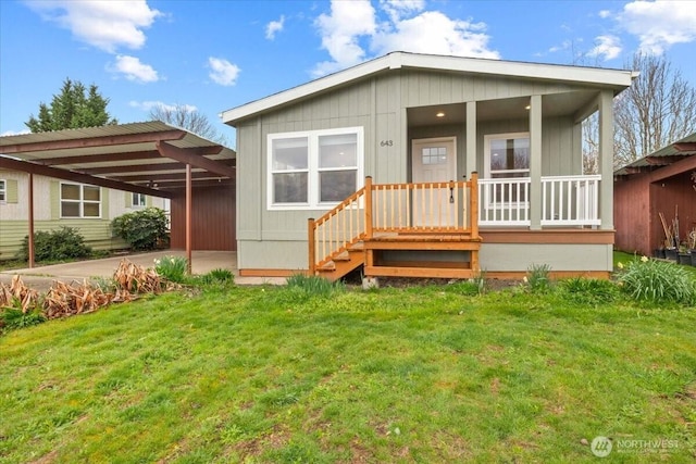 643 NW Hickory St, Mcminnville, OR 97128 - exterior space with a porch, a front lawn, and a carport