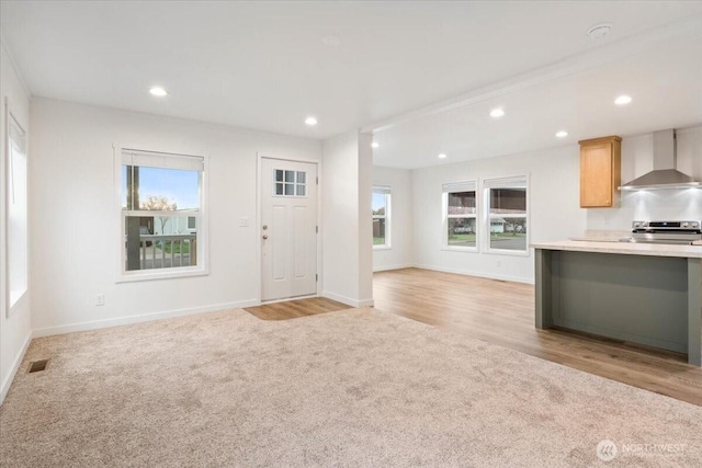 643 NW Hickory St, Mcminnville, OR 97128 - entrance foyer featuring light wood-style flooring, baseboards, visible vents, recessed lighting, and light colored carpet