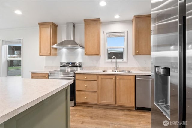 643 NW Hickory St, Mcminnville, OR 97128 - kitchen featuring stainless steel appliances, a sink, wall chimney range hood, crown molding, and light countertops