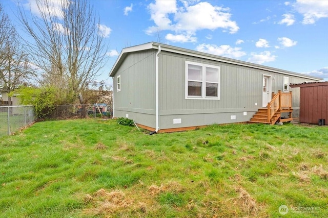 643 NW Hickory St, Mcminnville, OR 97128 - back of house featuring fence, crawl space, and a lawn