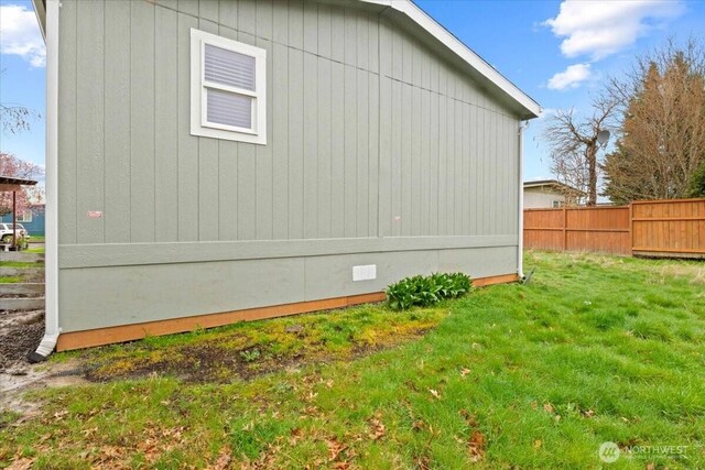 643 NW Hickory St, Mcminnville, OR 97128 - view of home's exterior with a lawn, fence, and crawl space