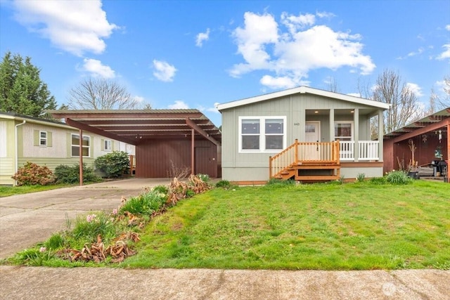 643 NW Hickory St, Mcminnville, OR 97128 - manufactured / mobile home with concrete driveway, a front lawn, and a carport