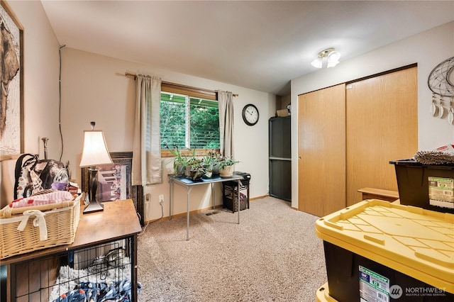 home office featuring baseboards and carpet